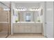 Bathroom boasts double sinks, a walk-in shower, and bright natural light at 145 Treeside Ter, Fayetteville, GA 30214