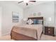 Bedroom with a bed, side tables, lamps, carpet flooring, and a neutral color palette at 145 Treeside Ter, Fayetteville, GA 30214