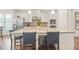 Modern kitchen boasting a large center island with seating and sleek stainless steel appliances at 145 Treeside Ter, Fayetteville, GA 30214