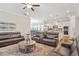Open-concept living space seamlessly connecting the living room, dining area, and kitchen at 145 Treeside Ter, Fayetteville, GA 30214