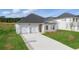 Beautiful single-story home featuring a two-car garage and a concrete driveway at 246 Orwell Dr, Social Circle, GA 30025