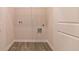 Walk-in closet with laminate floors and wire shelving for storage, located near two doors at 246 Orwell Dr, Social Circle, GA 30025