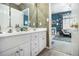 Bathroom with dual vanity and a view into the bedroom at 3901 Cherry Ridge Blvd, Decatur, GA 30034