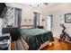 Bedroom with hardwood floors, a bed, and a window with decorative curtains at 3901 Cherry Ridge Blvd, Decatur, GA 30034