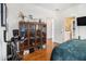 Bedroom showcasing hardwood floors, decorative shelving, a window and TV at 3901 Cherry Ridge Blvd, Decatur, GA 30034