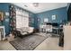 Cozy bedroom with futon, rug, and lots of wall art at 3901 Cherry Ridge Blvd, Decatur, GA 30034