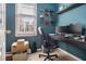 Small office with dark desk, dual monitors, a window and custom wall decoration at 3901 Cherry Ridge Blvd, Decatur, GA 30034