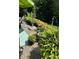 A brick patio is landscaped with multiple potted plants at 539 Wintergreen Way, Canton, GA 30115