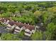 Aerial shot of townhomes surrounded by lush trees, showcasing a serene community setting at 705 Bridge Se Ln, Smyrna, GA 30082