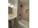 Bathroom featuring white subway tile, shower, pedestal sink, and mirror at 705 Bridge Se Ln, Smyrna, GA 30082