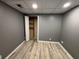 Bedroom featuring gray walls, vinyl floor, white trim, and a closet at 705 Bridge Se Ln, Smyrna, GA 30082