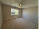 Large bedroom with a ceiling fan and big window providing plenty of light at 705 Bridge Se Ln, Smyrna, GA 30082