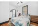 Bedroom featuring a ceiling fan, hardwood floors, and an ensuite bathroom at 1147 Oakland Sw Dr, Atlanta, GA 30310