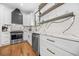 Bright modern kitchen featuring white cabinets, stainless steel appliances, granite countertops, and hardwood floors at 1147 Oakland Sw Dr, Atlanta, GA 30310