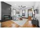 Stylish living room featuring a modern fireplace, hardwood floors, and neutral color palette at 1147 Oakland Sw Dr, Atlanta, GA 30310