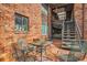 Outdoor patio area with brick surface and stairs leading to upper units at 1284 Piedmont Ne Ave # 12, Atlanta, GA 30309