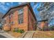Exterior view of a red brick apartment building on a sunny day at 1284 Piedmont Ne Ave # 12, Atlanta, GA 30309