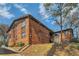 Apartment building with red brick, wood siding, and greenery at 1284 Piedmont Ne Ave # 12, Atlanta, GA 30309