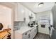 Bright kitchen featuring stainless steel appliances, white shaker cabinets, and a modern black faucet at 1284 Piedmont Ne Ave # 12, Atlanta, GA 30309