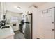 Galley kitchen features stainless steel appliances, white cabinets, and modern countertops at 1284 Piedmont Ne Ave # 12, Atlanta, GA 30309