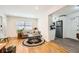 Bright living room with hardwood floors, neutral paint, and a large window at 1284 Piedmont Ne Ave # 12, Atlanta, GA 30309
