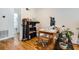Bright home office space with hardwood flooring, a desk, and an adjacent bathroom at 1284 Piedmont Ne Ave # 12, Atlanta, GA 30309