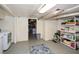 Basement with laundry machines and shelving at 2780 Eastfield Se Rd, Smyrna, GA 30080