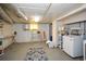 Basement laundry area with washer, dryer, and ample shelving at 2780 Eastfield Se Rd, Smyrna, GA 30080