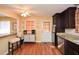 Bright kitchen with stainless steel appliances, breakfast bar, eat-in area, and checkered valance at 2780 Eastfield Se Rd, Smyrna, GA 30080