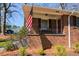 Welcoming front porch with brick detail and wrought iron railing at 2780 Eastfield Se Rd, Smyrna, GA 30080