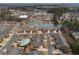 Aerial view of a residential neighborhood with a community pond and pool at 348 Lauren Ln, Woodstock, GA 30188