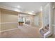 A carpeted basement features stairs and a partial view of a billiard room at 348 Lauren Ln, Woodstock, GA 30188