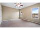 Comfortable bedroom with carpet, a ceiling fan, and windows with scenic views at 348 Lauren Ln, Woodstock, GA 30188