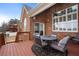 Spacious deck with patio furniture overlooking the backyard and featuring brick accents at 348 Lauren Ln, Woodstock, GA 30188