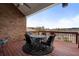 Outdoor deck with a wrought iron table and chairs overlooking a scenic lake view at 348 Lauren Ln, Woodstock, GA 30188