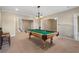 The billiard table in this game room is ready for play and entertainment at 348 Lauren Ln, Woodstock, GA 30188