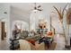 Well-lit living space with hardwood floors, a fireplace, and an open layout connecting to the dining and kitchen at 348 Lauren Ln, Woodstock, GA 30188