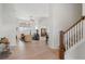 Inviting living area with hardwood floors, a staircase, and a seamless transition to the dining area at 348 Lauren Ln, Woodstock, GA 30188