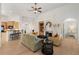 Bright, open living room with hardwood floors, fireplace, and seamless flow into the kitchen at 348 Lauren Ln, Woodstock, GA 30188