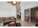 Comfortable sunroom seating area with fan, many windows, and natural light at 348 Lauren Ln, Woodstock, GA 30188