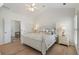 Comfortable main bedroom featuring a four-poster bed and an en-suite bathroom at 348 Lauren Ln, Woodstock, GA 30188