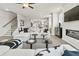 View of a stylish living room from a low angle with a sofa, fireplace, stairs and modern furnishings at 401 Nix Ln, Lawrenceville, GA 30046