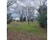 Large lot with established trees and plenty of space for outdoor activities at 582 S Cherokee Rd, Social Circle, GA 30025