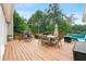 Spacious back deck with outdoor seating overlooking a private backyard with mature trees at 587 Morgan Ct, Hampton, GA 30228