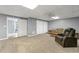 Finished basement area, offering a comfortable seating area and walk-out access at 587 Morgan Ct, Hampton, GA 30228