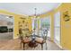 Cozy breakfast nook filled with natural light, featuring a glass table and comfortable seating at 587 Morgan Ct, Hampton, GA 30228