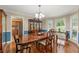 Elegant dining room with hardwood floors, a large window, and classic furniture at 587 Morgan Ct, Hampton, GA 30228