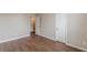 Bedroom featuring neutral walls and hardwood floors at 105 Kentwood Springs Dr, Hampton, GA 30228