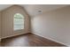 Bedroom featuring vaulted ceilings, hardwood floors, and a spacious interior at 105 Kentwood Springs Dr, Hampton, GA 30228