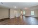 A bonus room with wood-look flooring and access to the bathroom and closet for convenience at 105 Kentwood Springs Dr, Hampton, GA 30228